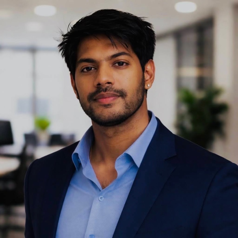 Agastya Kommanamanchi in a navy blazer